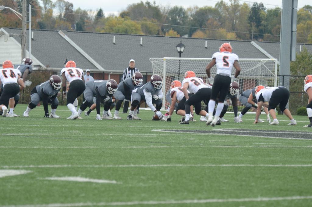 Senior Terence Stewart gets set to snap the ball to his teammates in the Homecoming game against rival Georgetown College. The Campbellsville University Tigers lost a heartbreaker 31-24 to Georgetown's Tigers in double overtime. (Campbellsville University Photo by Maiya Henderson)